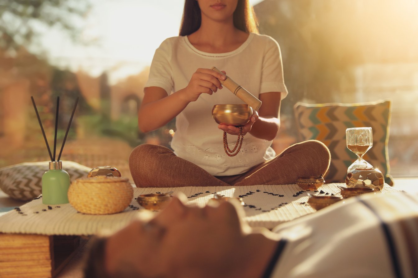 Man at Healing Session with Singing Bowl Indoors